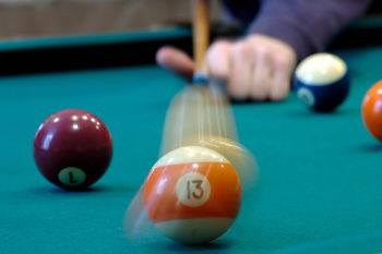 Playing pool is an example of the conservation of energy - the cue transfers energy to the ball, but energy is never created or destroyed.