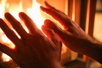 Placing your hands in front of a fire is an example of the flow of thermal energy where the fire increases the temperature of your hands.