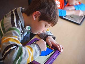 Child doing work in a blended learning classroom