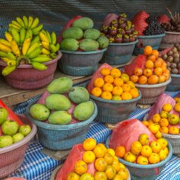 various tropical and exotic fruits in buckets at a market