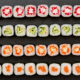 4 types of vibrantly colored sushi arranged into rows