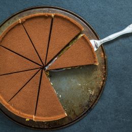 brown colored pie cut into 10 slices with 2 missing slices missing