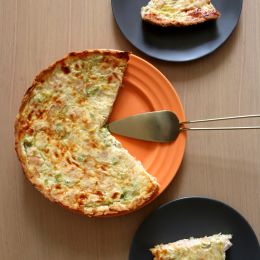 circular quiche food with 1/3 slice missing on 3 different plates