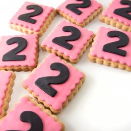 pink cookies with #2 written on them