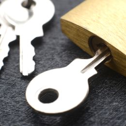 key inserted into a padlock