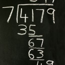 division problem drawn on a chalk board