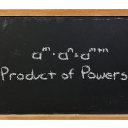 product of powers equation with exponents on a black chalkboard
