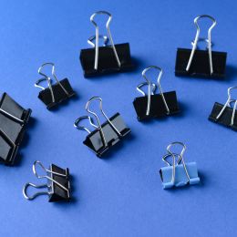 various sizes of black binder clips that can be used on paper
