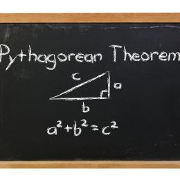 pythagorean theorem images written on a black chalkboard