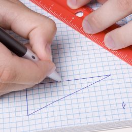 right triangle being drawn on graph paper in a geometry lesson