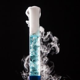 overflowing test tube with blue liquid