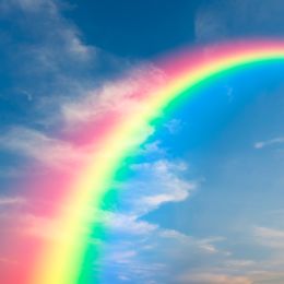 rainbow with a blue sky