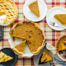 pie with slices spread around table