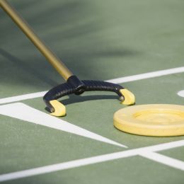 shuffleboard puck being pushed