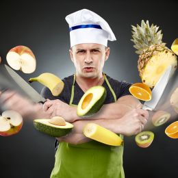 chef cutting fruits and vegetables in the air